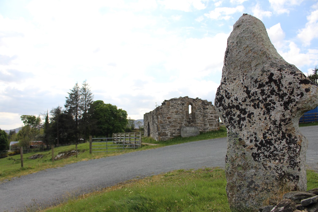 Stone cross and ruins of St Colmcille's abbey at Gartan in County Donegal