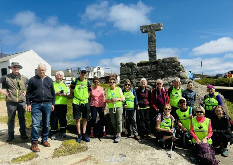 A walking group on Sli Cholmcille enjoying a trip to Tory Island, County Donegal, Ireland.